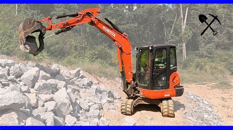 Mini Excavator & Skid Steer: Rip Rap on a Hillside 